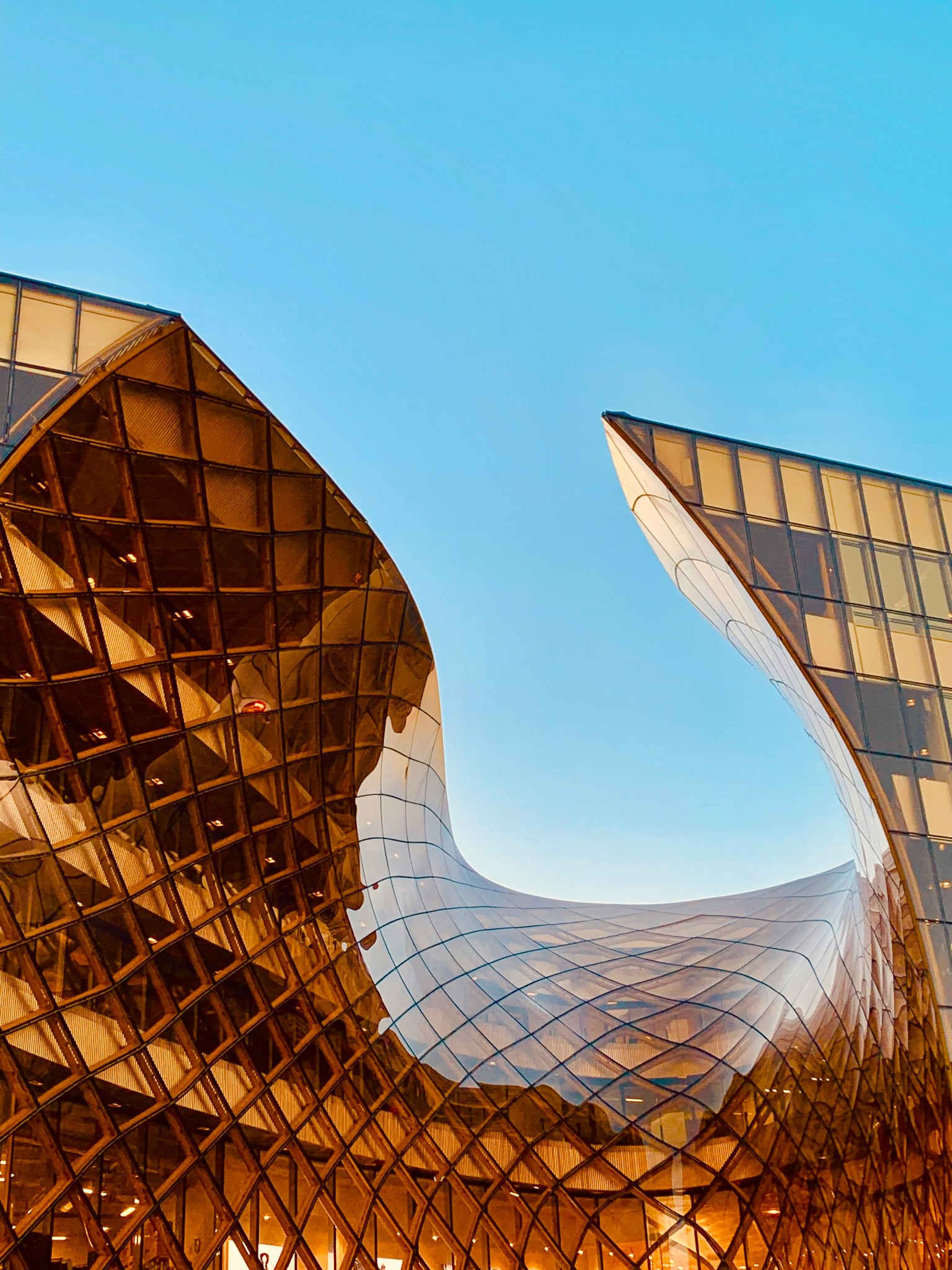 structural photography of amber glass building