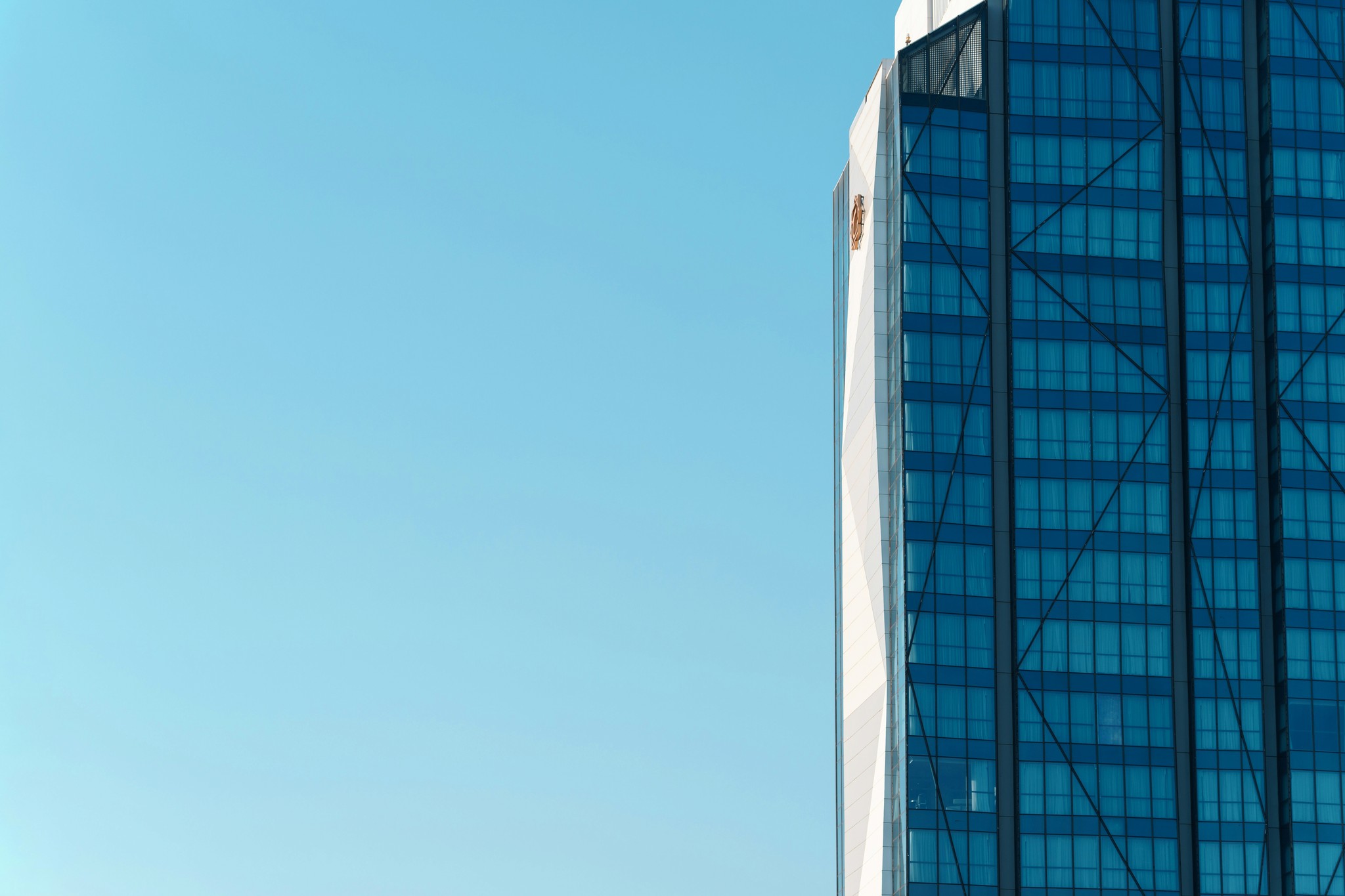 a very tall building with a blue sky in the background